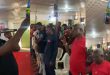 Moment a pastor and his congregation were seen holding a bottle of beer while praying in church (VIDEO) “They are lifting their trophies to God”